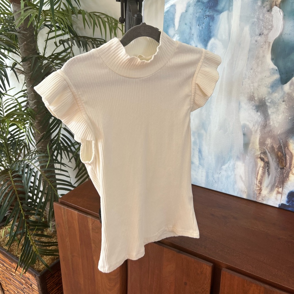 Fitted. Ruffle sleeve cream ribbed top. Off white
